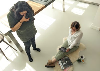 Vinita taking a photo of client from above